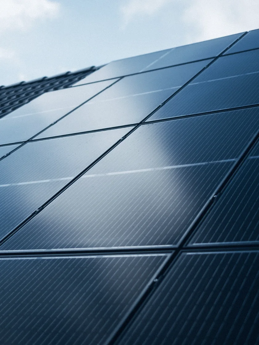 Solar panels under a bright sky