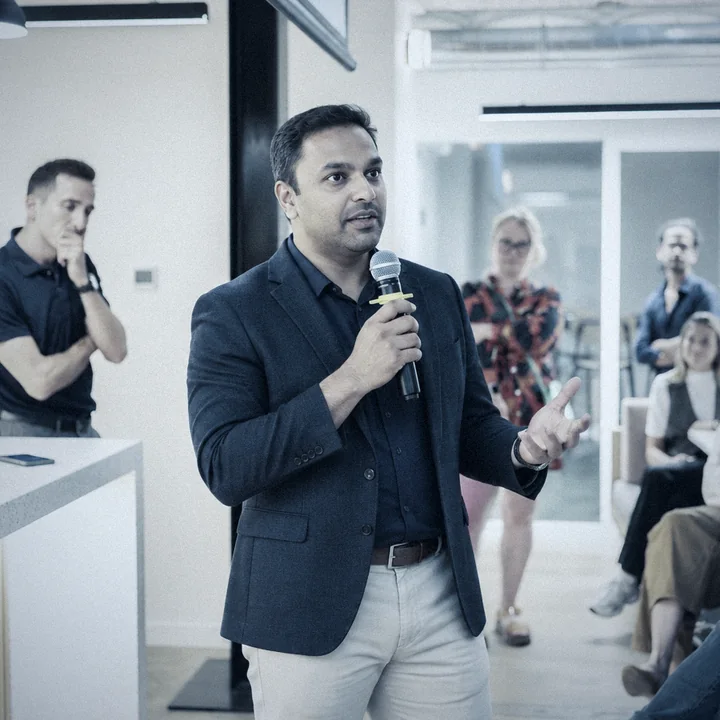 Speaking about DecaPlants to an audience at an event
